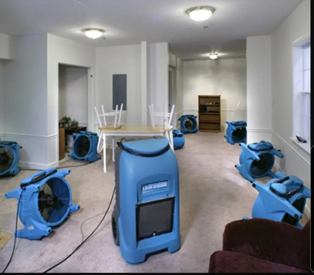 Air movers and dehumidifier setup for Water Damage Restoration in West York